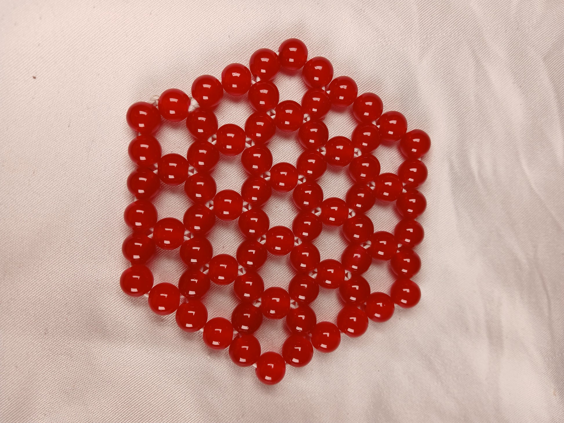 Red Beaded Hexagon Coaster – Handcrafted African Design